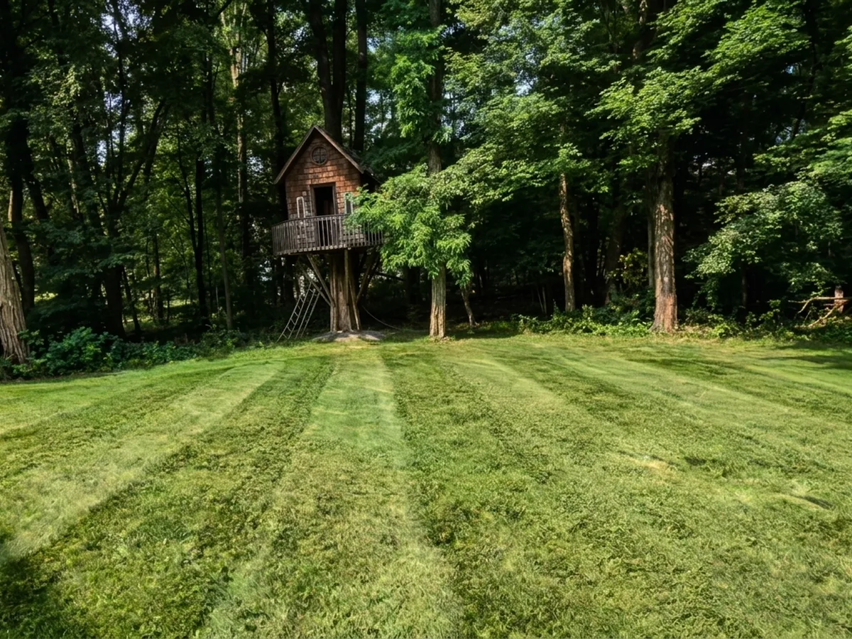 A striped residential lawn cut on a weekly route